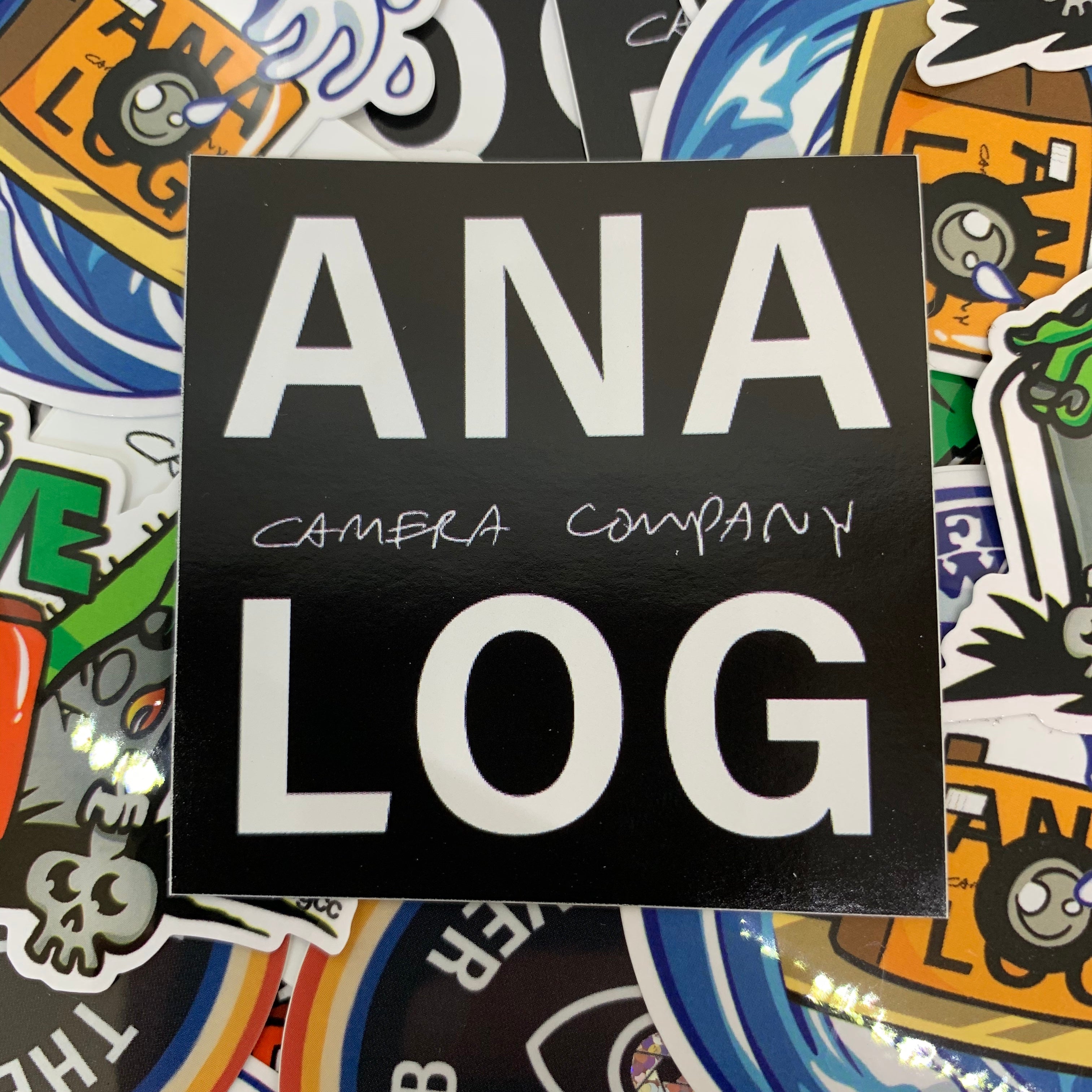 analog camera company black logo